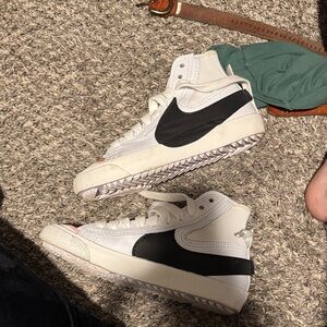 Nike women’s White and Black High-Top Sneakers